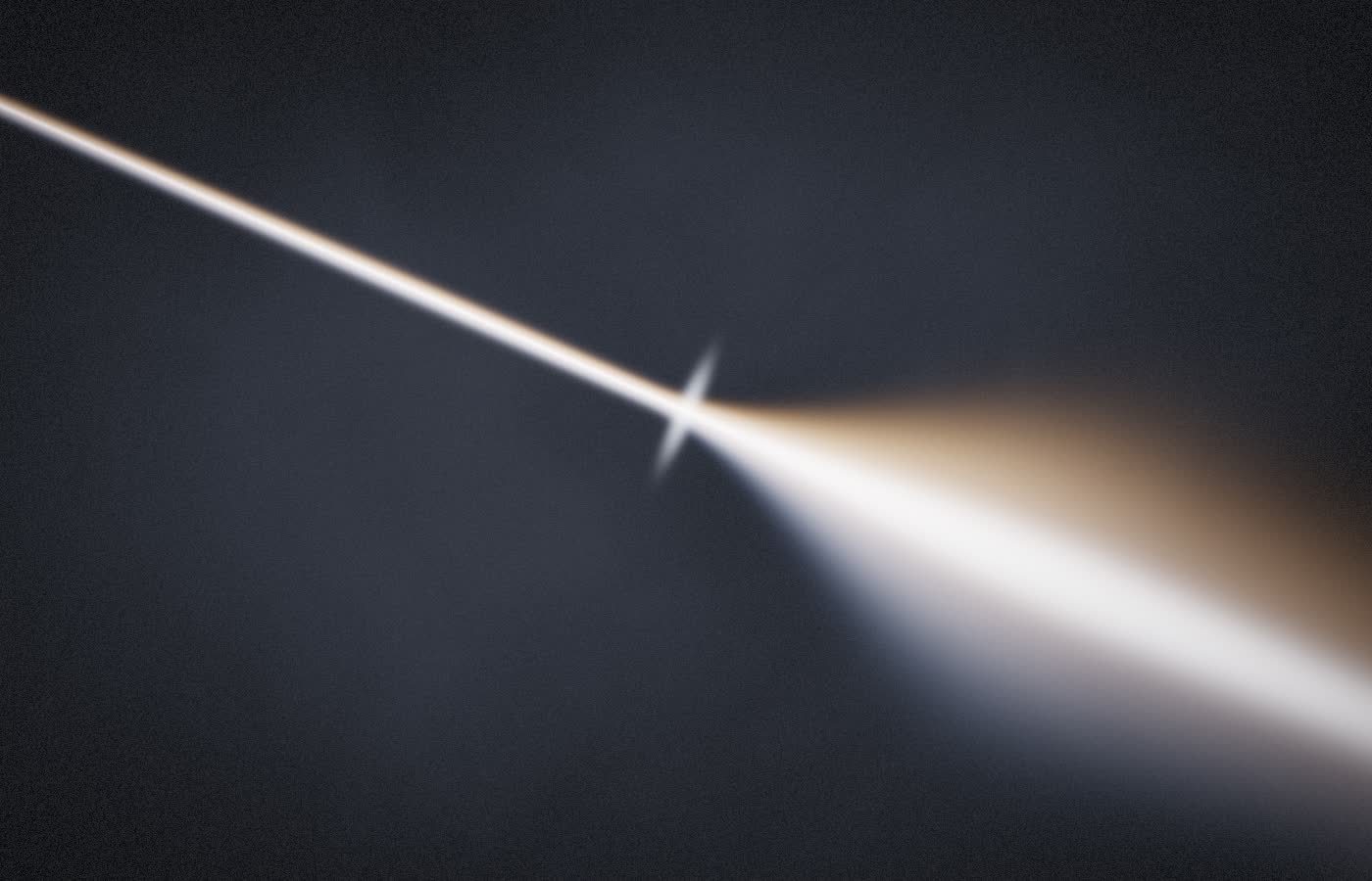 A beam of white light fanning into warm and cool bands as it refracts.