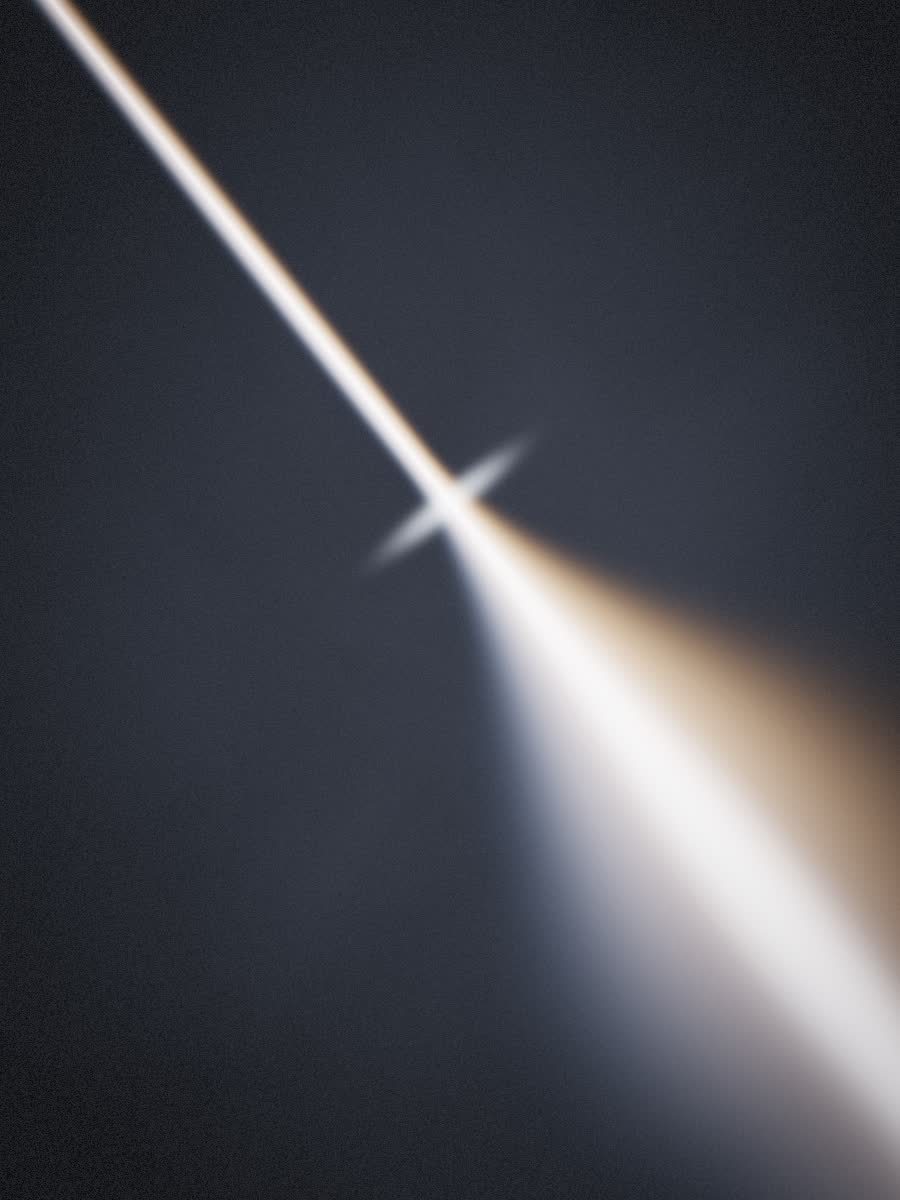 A hard beam of light fanning outward after passing an edge.